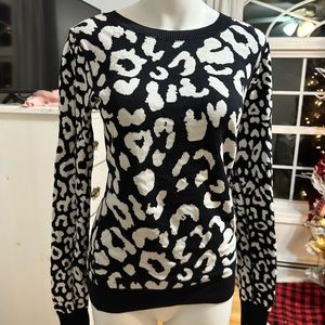 Women’s Express black and white leopard print sweater.